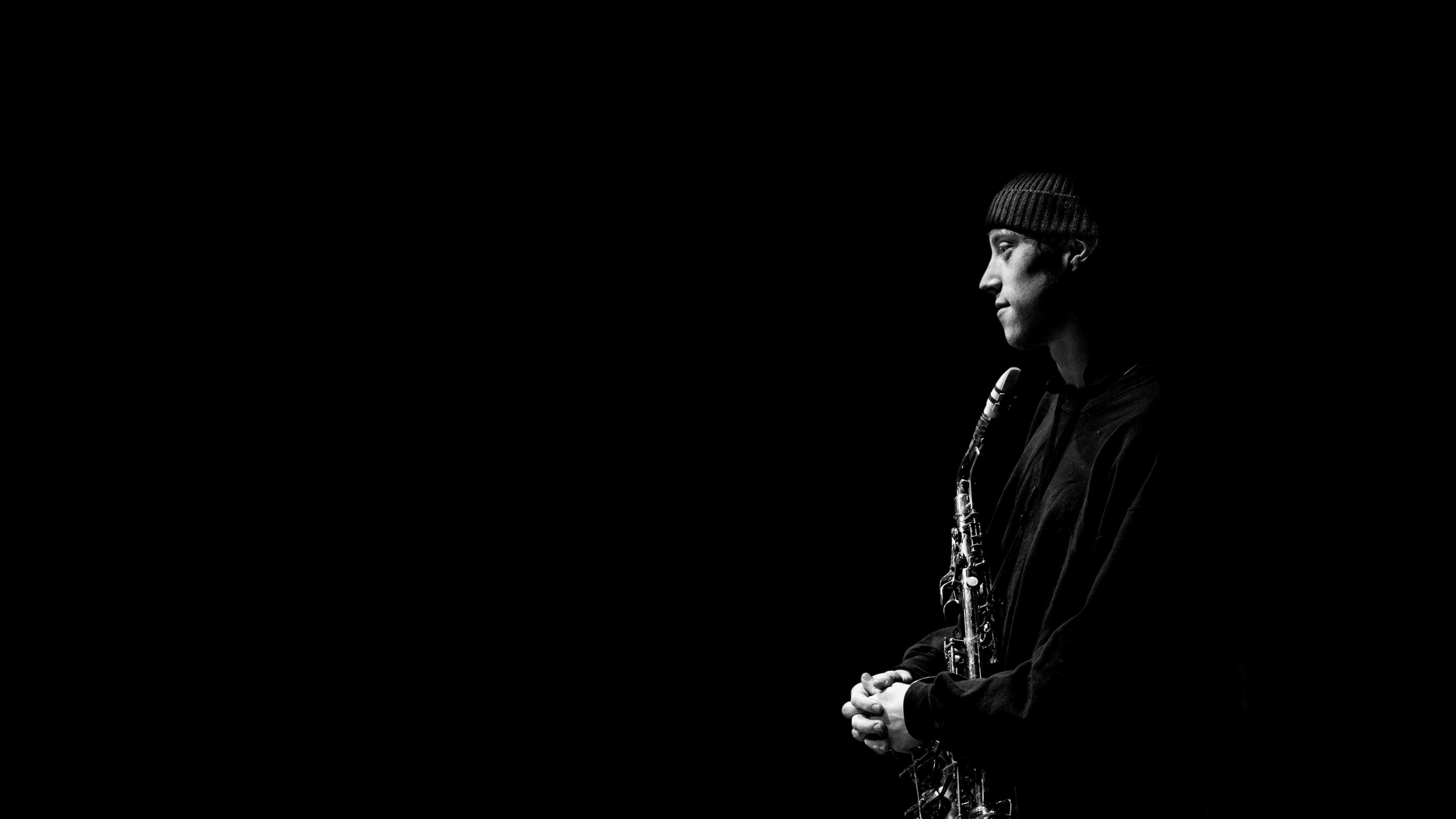 R-J playing saxophone